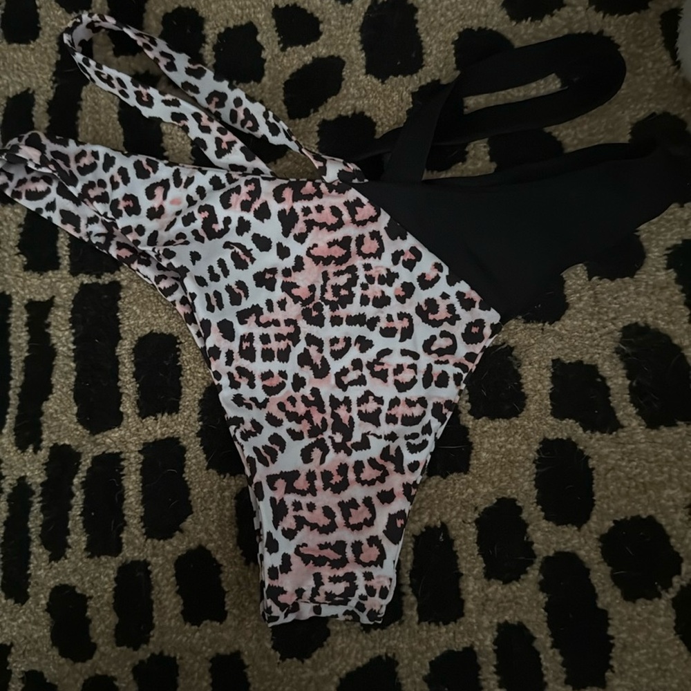 Pink leopard and black cross bathing suit bottoms